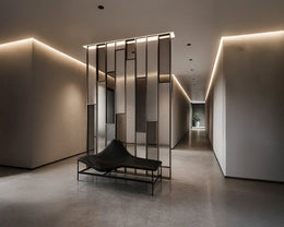 Sculptural Metal-Glass Divider in a Minimalist Transition Hallway