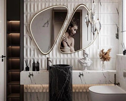 Avant-Garde Powder Room with Sculptural Mirror, Monochrome Marble & Modern Art Expression