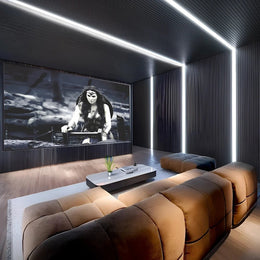 Futuristic Black & Walnut Home Theatre with Plush Loungers and Linear Glow