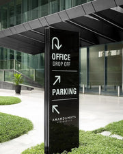 Monolithic Wayfinding Totem for Office Drop-Off and Parking Navigation