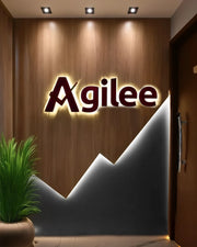 Dynamic Corporate Branding Wall with Illuminated Identity and Growth-Inspired Geometry